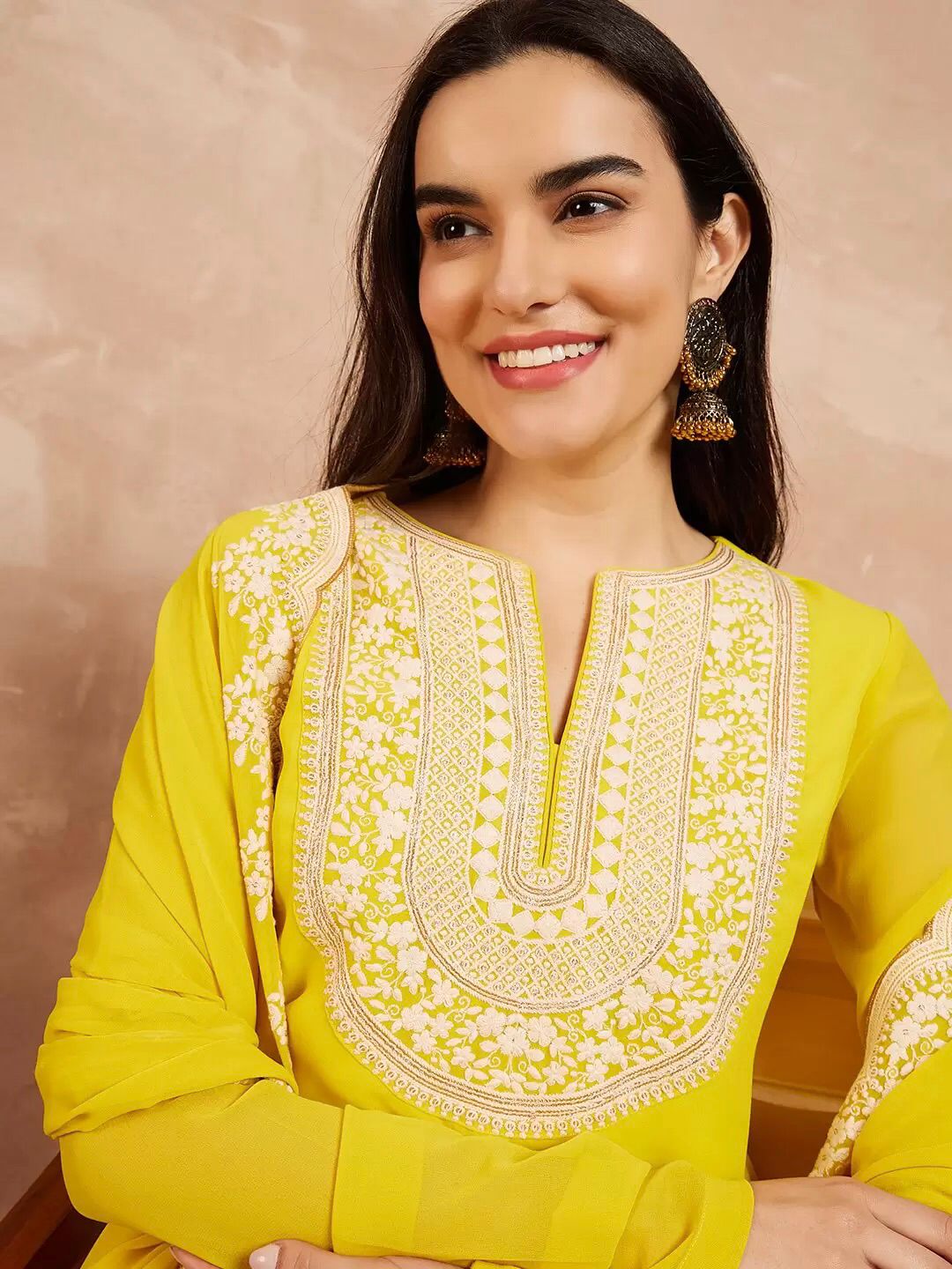 "Close-up of embroidery work on faux georgette fabric showing fine detailing"